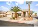 Single-story house with a two-car garage and landscaping at 1036 Aspen Daisy Ave, Henderson, NV 89074