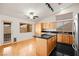 Kitchen with light wood cabinets, granite counters, and island at 1036 Aspen Daisy Ave, Henderson, NV 89074