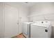 Laundry room with washer, dryer, and shelving at 1036 Aspen Daisy Ave, Henderson, NV 89074