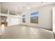 Living room with tile flooring and a high ceiling at 1036 Aspen Daisy Ave, Henderson, NV 89074