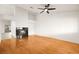 Living room with hardwood floors, fireplace, and ceiling fan at 1036 Aspen Daisy Ave, Henderson, NV 89074