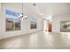 Bright living room with tile floors and large windows at 1036 Aspen Daisy Ave, Henderson, NV 89074