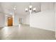 Living room with tile floors, high ceilings and chandelier at 1036 Aspen Daisy Ave, Henderson, NV 89074