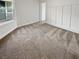 Cozy carpeted bedroom with white walls and board and batten trim at 10425 Seelos St, Las Vegas, NV 89178