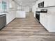 Modern white kitchen with stainless steel appliances and quartz countertops at 10425 Seelos St, Las Vegas, NV 89178