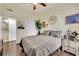 Inviting bedroom with a comfortable bed, wooden floors, and ample natural light at 10550 W Alexander Rd # 1007, Las Vegas, NV 89129