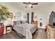 Cozy bedroom featuring a comfortable bed, ceiling fan, and natural light at 10550 W Alexander Rd # 1007, Las Vegas, NV 89129