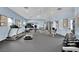 Bright and well-equipped community gym with modern exercise equipment, mirrors, and natural light at 10550 W Alexander Rd # 1007, Las Vegas, NV 89129