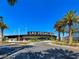 Exterior view of the Las Vegas Ballpark under a clear blue sky with palm trees at 11250 Hidden Peak Ave # 208, Las Vegas, NV 89135