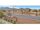 Exterior shot of homes in a community with mountain views, landscaping, and well-maintained street at 11250 Hidden Peak Ave # 208, Las Vegas, NV 89135