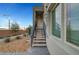 Inviting exterior entrance with landscaped walkway and stairway to unit entrance at 11250 Hidden Peak Ave # 208, Las Vegas, NV 89135