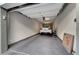 Neat garage interior with car, epoxy floor, and well-lit space at 11250 Hidden Peak Ave # 208, Las Vegas, NV 89135