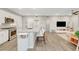 Open-concept kitchen with bar seating, island sink, and modern finishes at 11250 Hidden Peak Ave # 208, Las Vegas, NV 89135