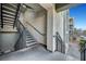 Exterior staircase with metal handrails leading to the upper levels of the condo building at 11250 Hidden Peak Ave # 208, Las Vegas, NV 89135