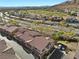 This is an aerial view of a neighborhood with a golf course in the distance at 11518 Belmont Lake Dr # 104, Las Vegas, NV 89135