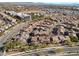 A high-angle view showcases a well-planned residential area, featuring neatly arranged homes and landscaping at 11518 Belmont Lake Dr # 104, Las Vegas, NV 89135