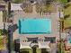 Aerial view of a community pool surrounded by lounge chairs and shade structures at 11518 Belmont Lake Dr # 104, Las Vegas, NV 89135