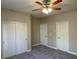 Bedroom features plush carpeting, large closet, and neutral color palette at 12048 La Palmera Ave, Las Vegas, NV 89138