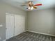 Bedroom features plush carpeting, large closet, and neutral color palette at 12048 La Palmera Ave, Las Vegas, NV 89138