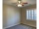 Neutral bedroom showcasing window with shutters and ceiling fan with light at 12048 La Palmera Ave, Las Vegas, NV 89138