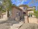 Stunning home with stone accents, a charming courtyard, and a well-manicured front yard at 12048 La Palmera Ave, Las Vegas, NV 89138