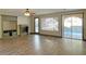 Living room featuring a fireplace, built-in shelves, and sliding doors to the pool area at 12048 La Palmera Ave, Las Vegas, NV 89138