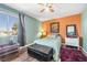 Bedroom with wood floors, two-toned walls, and a double bed at 122 Boysenberry Ln, Henderson, NV 89074