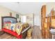 Bedroom with wood floors, bookcase, and double bed at 122 Boysenberry Ln, Henderson, NV 89074