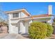 Two-story house with a one-car garage and neatly landscaped front yard at 122 Boysenberry Ln, Henderson, NV 89074