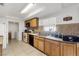 View of kitchen with appliances and wood cabinets at 122 Boysenberry Ln, Henderson, NV 89074