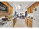 Long kitchen with ample counter space and wood cabinets at 122 Boysenberry Ln, Henderson, NV 89074