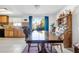 Kitchen and dining area with wood cabinets and sliding glass door at 122 Boysenberry Ln, Henderson, NV 89074