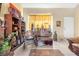 Living room corner features bookshelves, a piano, and a rocking chair at 122 Boysenberry Ln, Henderson, NV 89074