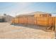 House with a wooden fence and empty lot at 1220 E Ogden Ave, Las Vegas, NV 89101