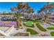 Manicured backyard featuring a basketball court, putting green, and multiple seating areas at 1245 S Rancho Dr, Las Vegas, NV 89102