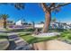 Outdoor space with a basketball court, mature trees, and artificial turf for low maintenance at 1245 S Rancho Dr, Las Vegas, NV 89102