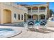 The backyard pool is surrounded by lounge chairs and a hot tub for enjoying the day at 1245 S Rancho Dr, Las Vegas, NV 89102