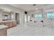 Large bathroom featuring a double sink vanity, soaking tub, and separate glass enclosed shower at 1245 S Rancho Dr, Las Vegas, NV 89102