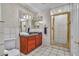 Neutral bathroom featuring tile floors, a standing shower, and a single sink vanity at 1245 S Rancho Dr, Las Vegas, NV 89102