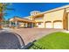 Elegant home featuring a porte cochere, lush turf and a circular driveway at 1245 S Rancho Dr, Las Vegas, NV 89102