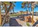 Home's exterior with lush lawn and desert landscaping at 1245 S Rancho Dr, Las Vegas, NV 89102