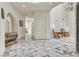 Open-concept foyer with marble flooring, archways, and elegant decor creates a welcoming entrance at 1245 S Rancho Dr, Las Vegas, NV 89102