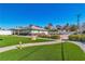 Home's lush front yard features a manicured lawn and desert landscaping at 1245 S Rancho Dr, Las Vegas, NV 89102