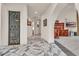 Bright hallway leads to a dining room and is highlighted by unique tile design at 1245 S Rancho Dr, Las Vegas, NV 89102