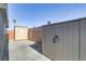 A functional backyard features two storage sheds of different sizes and concrete flooring at 139 Ivy St, Henderson, NV 89015