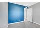 Bedroom with an accent wall, grey carpet and a bright, natural light at 139 Ivy St, Henderson, NV 89015