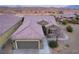 Single-story home with a two-car garage and desert landscaping at 1460 Tannery Hts, Mesquite, NV 89034