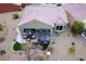 Aerial view of home with backyard patio, hot tub, and landscaping at 1460 Tannery Hts, Mesquite, NV 89034