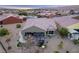 Aerial view of home with backyard patio, hot tub, and landscaping at 1460 Tannery Hts, Mesquite, NV 89034