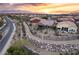 Community view of homes with desert landscape and sunset at 1460 Tannery Hts, Mesquite, NV 89034